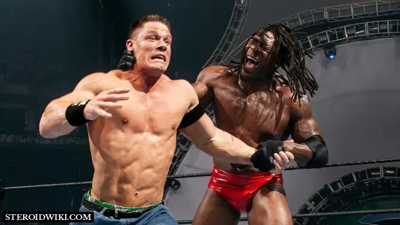 Booker T pushing Cena