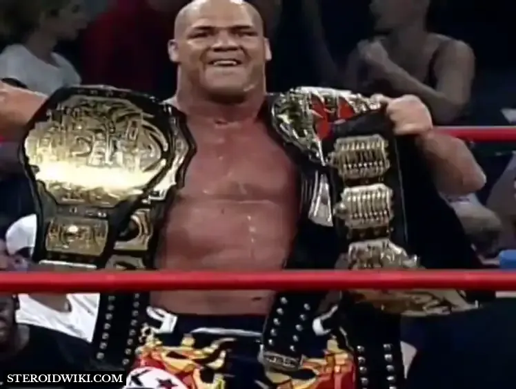 Kurt Angle showing off his multiple belts